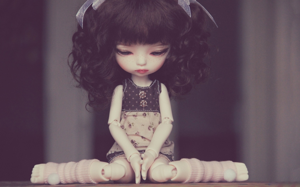 sad-doll-sitting